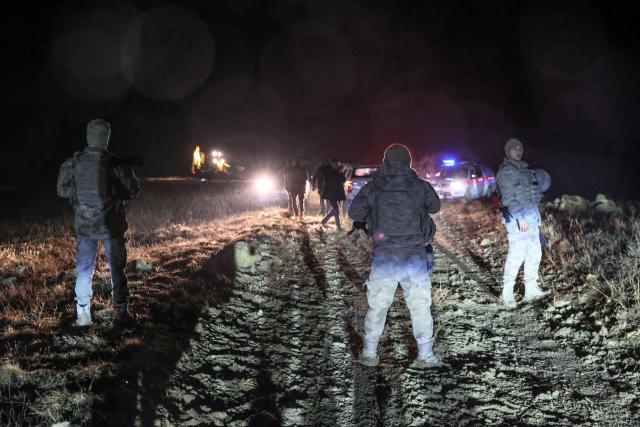 Turkish soldiers stand guard at the wreckage site of a Libya-bound business jet as search and rescue operations continue following the crash of a Falcon 50 aircraft carrying Libyan Chief of Staff General Muhammad Ali Ahmed Al-Haddad, found 2 kilometers south of Kesikkavak Village at Haymana district in Ankara on December 23, 2025. The head of Libya's armed forces and four other passengers died on December 23 when their business jet crashed shortly after taking off from Ankara, officials in Turkey's capital and Tripoli said.
The wreckage of their Falcon 50 aircraft was located by Turkish security personnel in the Haymana district near Ankara, Turkish Interior Minister Ali Yerlikaya said. (Photo by ADEM ALTAN / AFP)