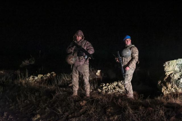 Turkish soldiers stand guard at the wreckage site of a Libya-bound business jet as search and rescue operations continue following the crash of a Falcon 50 aircraft carrying Libyan Chief of Staff General Muhammad Ali Ahmed Al-Haddad, found 2 kilometers south of Kesikkavak Village at Haymana district in Ankara on December 23, 2025. The head of Libya's armed forces and four other passengers died on December 23 when their business jet crashed shortly after taking off from Ankara, officials in Turkey's capital and Tripoli said.
The wreckage of their Falcon 50 aircraft was located by Turkish security personnel in the Haymana district near Ankara, Turkish Interior Minister Ali Yerlikaya said. (Photo by ADEM ALTAN / AFP)