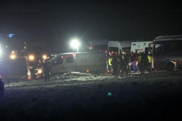 Rescuers work at the wreckage site as search and rescue operations continue following the crash of a Libya-bound business jet carrying Libyan Chief of Staff General Muhammad Ali Ahmed Al-Haddad, found about 1.2 miles (two km) south of Kesikkavak village in the Haymana district of Ankara on December 24, 2025. The head of Libya's armed forces and four other passengers died on Tuesday when their business jet crashed shortly after taking off from Ankara, officials in Turkey's capital and Tripoli said.
The wreckage of their Falcon 50 aircraft was located by Turkish security personnel in the Haymana district near Ankara, Turkish Interior Minister Ali Yerlikaya said. (Photo by ADEM ALTAN / AFP)