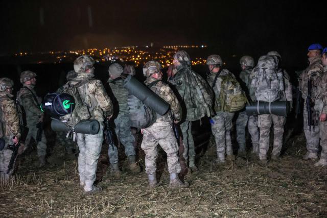 Turkish soldiers stand guard at the wreckage site of a Libya-bound business jet as search and rescue operations continue following the crash of a Falcon 50 aircraft carrying Libyan Chief of Staff General Muhammad Ali Ahmed Al-Haddad, found about 1.2 miles (two km) south of Kesikkavak village in the Haymana district of Ankara on December 23, 2025. The head of Libya's armed forces and four other passengers died on December 23 when their business jet crashed shortly after taking off from Ankara, officials in Turkey's capital and Tripoli said.
The wreckage of their Falcon 50 aircraft was located by Turkish security personnel in the Haymana district near Ankara, Turkish Interior Minister Ali Yerlikaya said. (Photo by ADEM ALTAN / AFP)