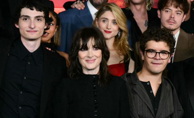 (FILES) (L/R) Canadian actor Finn Wolfhard, US actress Winone Ryder, US actress Natalia Dyer, US actor Gaten Matarazzo and English actor Charlie Heaton attend the world premiere of Netflix's "Stranger Things", Season 5, at the TCL Chinese theatre in Los Angeles on November 6, 2025. The hit fantasy series Stranger Things returns to Netflix on December 26, 2025 for three new episodes of the fifth and final season, before the grand finale on January 1st. (Photo by Frederic J. Brown / AFP)