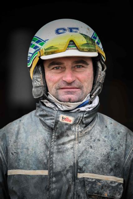 Horse Josh Power's French driver and trainer Sebastien Ernault poses after a training session at the Le Long Bois in Saint-Come-du-Mont, northwestern France on December 23, 2025. Horse Josh Power has qualified, and is one of the favorites, for the 105th edition of the Prix d'Amerique, which will be held at the Paris-Vincennes racecourse on January 25, 2026. (Photo by LOU BENOIST / AFP)
