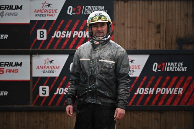 Horse Josh Power's French driver and trainer Sebastien Ernault poses after a training session at the Le Long Bois in Saint-Come-du-Mont, northwestern France on December 23, 2025. Horse Josh Power has qualified, and is one of the favorites, for the 105th edition of the Prix d'Amerique, which will be held at the Paris-Vincennes racecourse on January 25, 2026. (Photo by LOU BENOIST / AFP)