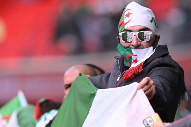 An Algeria supporter arrives for the Africa Cup of Nations (CAN) Group E football match between Algeria and Sudan at Moulay Hassan Stadium in Rabat on December 24, 2025. (Photo by SEBASTIEN BOZON / AFP)