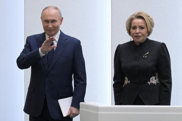 In this pool photograph distributed by the Russian state agency Sputnik, Russia's President Vladimir Putin and Federation Council speaker Valentina Matviyenko attend a session of the Federation Council, the upper house of Russia's parliament, in Moscow on December 24, 2025. (Photo by Alexey NIKOLSKY / POOL / AFP)