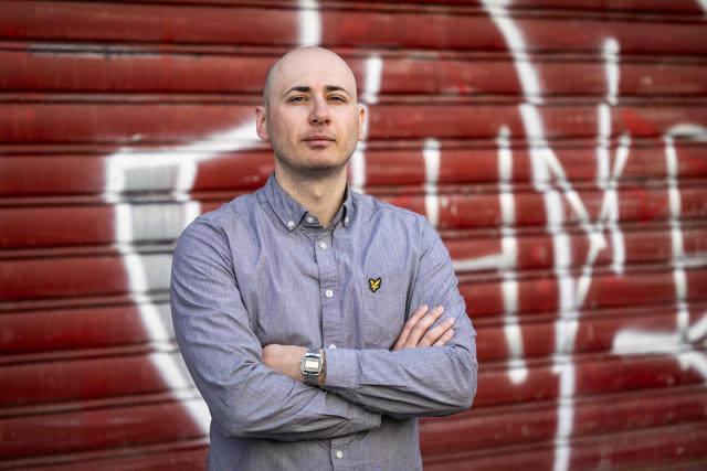 (FILES) Albanian anti-fascist activist Rexhino Abazaj "Gino" poses during a photo session in Paris on April 4, 2025. The Albanian anti-fascist activist known as ‘Gino’, whom France had refused to extradite to Hungary for fear of his fundamental rights being violated, and who is now wanted by Germany, was released on December 24, 2025, under judicial supervision. (Photo by BERTRAND GUAY / AFP)