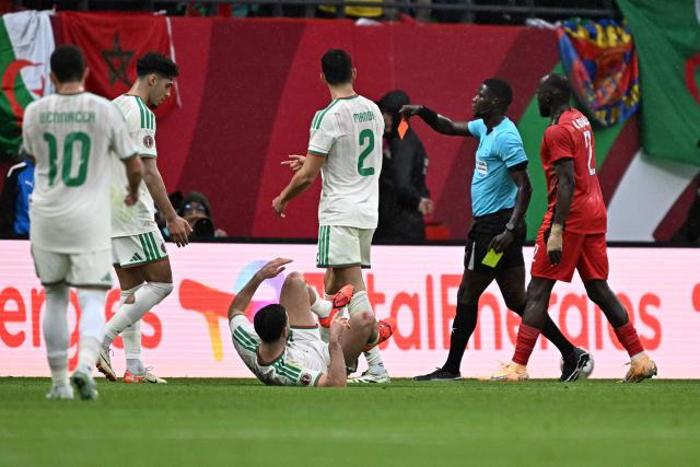 Algeria's defender #15 Rayan Ait-Nouri  reacts after being fouled by Sudan's midfielder #15 Salaheldin Adil (unseen) who is then sent off during the Africa Cup of Nations (CAN) Group E football match between Algeria and Sudan at Moulay Hassan Stadium in Rabat on December 24, 2025. (Photo by Gabriel BOUYS / AFP)