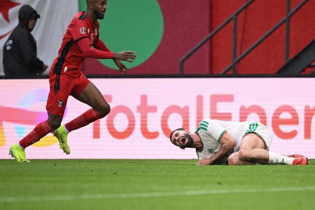 Sudan's midfielder #15 Salaheldin Adil (L) tackles Algeria's defender #15 Rayan Ait-Nouri and is then sent off during the Africa Cup of Nations (CAN) Group E football match between Algeria and Sudan at Moulay Hassan Stadium in Rabat on December 24, 2025. (Photo by SEBASTIEN BOZON / AFP)