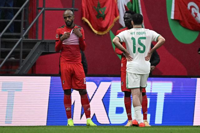 Sudan's midfielder #15 Salaheldin Adil (L) reacts after being sent off for a foul on Algeria's defender #15 Rayan Ait-Nouri during the Africa Cup of Nations (CAN) Group E football match between Algeria and Sudan at Moulay Hassan Stadium in Rabat on December 24, 2025. (Photo by Gabriel BOUYS / AFP)