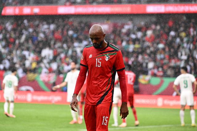 Sudan's midfielder #15 Salaheldin Adil leaves the pitch after being sent off for a foul on Algeria's defender #15 Rayan Ait-Nouri during the Africa Cup of Nations (CAN) Group E football match between Algeria and Sudan at Moulay Hassan Stadium in Rabat on December 24, 2025. (Photo by SEBASTIEN BOZON / AFP)