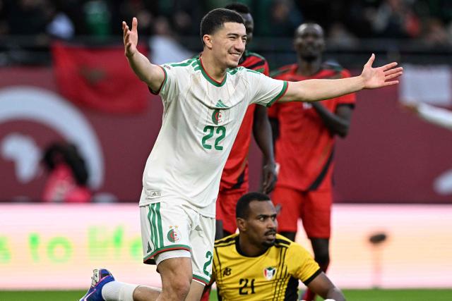 Algeria's midfielder #22 Ibrahim Maza celebrates scoring the team's third goal past Sudan's goalkeeper #21 Monged Elneel during the Africa Cup of Nations (CAN) Group E football match between Algeria and Sudan at Moulay Hassan Stadium in Rabat on December 24, 2025. (Photo by Gabriel BOUYS / AFP)
