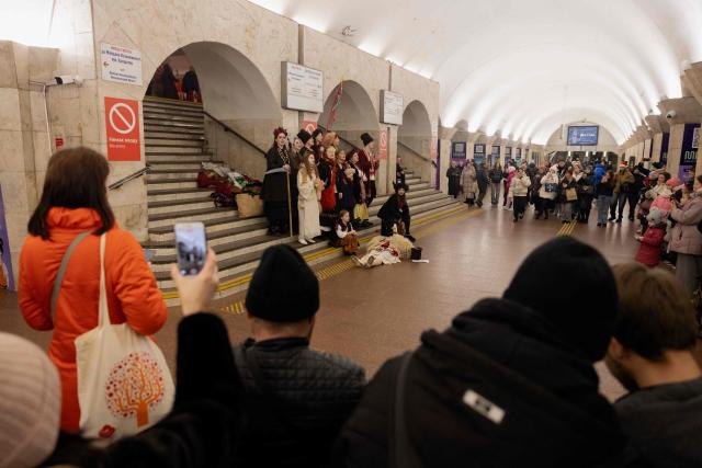 Participants of nativity scene, Vertep in Ukraine, perform in the subway in Kyiv on December 24, 2025, amid the Russian invasion of Ukraine. (Photo by Tetiana DZHAFAROVA / AFP)