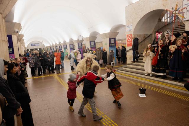 Participants of nativity scene, Vertep in Ukraine, perform in the subway in Kyiv on December 24, 2025, amid the Russian invasion of Ukraine. (Photo by Tetiana DZHAFAROVA / AFP)
