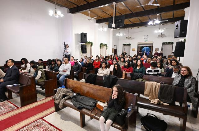 Christian worshippers attend a Christmas mass at the National Evangelical Church in Kuwait City on December 24, 2025. (Photo by YASSER AL-ZAYYAT / AFP)