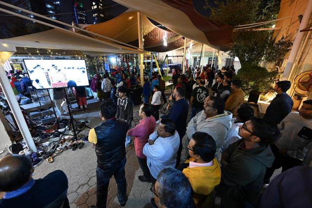 Christian worshippers attend a Christmas mass at the National Evangelical Church in Kuwait City on December 24, 2025. (Photo by YASSER AL-ZAYYAT / AFP)