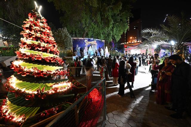 Christian worshippers attend a Christmas mass at the National Evangelical Church in Kuwait City on December 24, 2025. (Photo by YASSER AL-ZAYYAT / AFP)