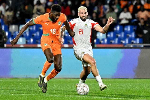 Ivory Coast's midfielder #18 Ibrahim Sangare and Mozambique's midfielder #21 Ricardo Guimaraes compete for the ball during the Africa Cup of Nations (CAN) Group F football match between Ivory Coast and Mozambique at Marrakesh Stadium in Marrakesh on December 24, 2025. (Photo by Khaled DESOUKI / AFP)