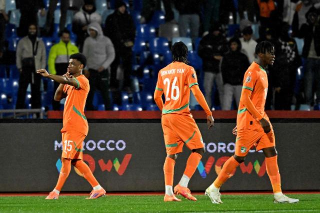 Ivory Coast's forward #15 Amad Diallo (L) celebrates scoring the team's first goal during the Africa Cup of Nations (CAN) Group F football match between Ivory Coast and Mozambique at Marrakesh Stadium in Marrakesh on December 24, 2025. (Photo by Khaled DESOUKI / AFP)