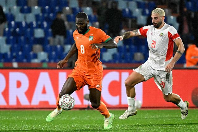 Ivory Coast's midfielder #08 Franck Kessie beats Mozambique's midfielder #21 Ricardo Guimaraes during the Africa Cup of Nations (CAN) Group F football match between Ivory Coast and Mozambique at Marrakesh Stadium in Marrakesh on December 24, 2025. (Photo by Khaled DESOUKI / AFP)
