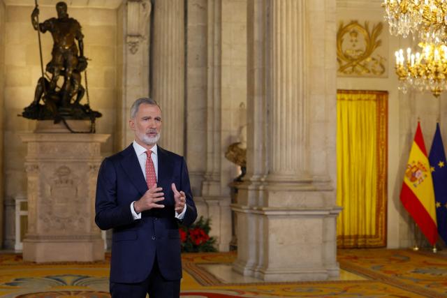 Spain's King Felipe VI delivers his traditional Christmas Eve speech  at the Royal Palace in Madrid and publicly broadcasted on December 24, 2025. King Felipe VI urged Spaniards to protect "democratic coexistence" against the perils of political polarisation, warning in a Christmas message broadcast today that "tension" was causing popular disaffection. (Photo by Andres BALLESTEROS / POOL / AFP)