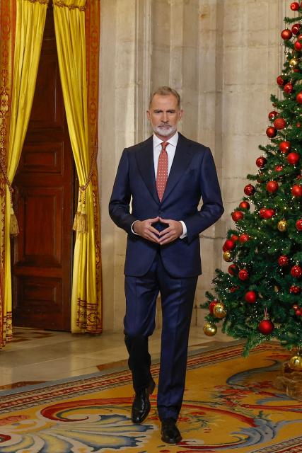 Spain's King Felipe VI arrives to deliver his traditional Christmas Eve speech  at the Royal Palace in Madrid and publicly broadcasted on December 24, 2025. King Felipe VI urged Spaniards to protect "democratic coexistence" against the perils of political polarisation, warning in a Christmas message broadcast today that "tension" was causing popular disaffection. (Photo by Andres BALLESTEROS / POOL / AFP)