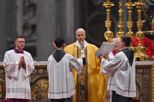 Pope Leo XIV (C) performs the Christmas Eve mass at St Peter's Basilica in the Vatican on December 24, 2025. (Photo by Andreas SOLARO / AFP)