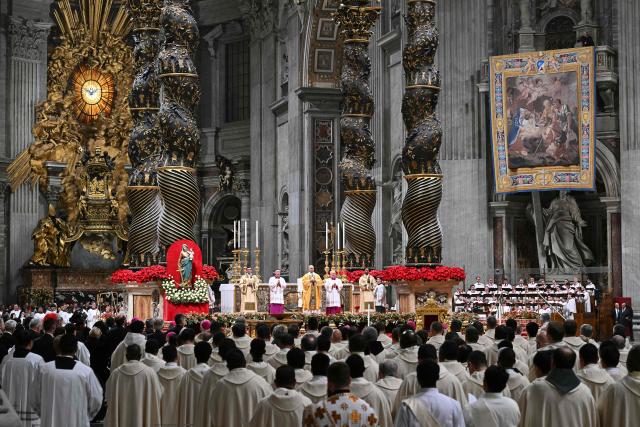 Pope Leo XIV (C) performs the Christmas Eve mass at St Peter's Basilica in the Vatican on December 24, 2025. (Photo by Andreas SOLARO / AFP)