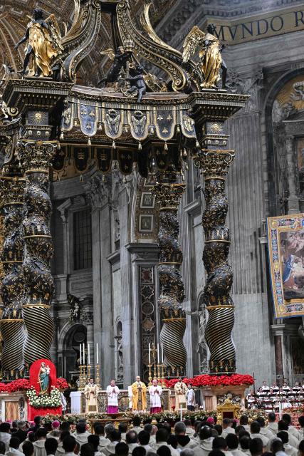 A general view shows a nview of the basilica interior as Pope Leo XIV leads the Christmas Eve mass at St Peter's Basilica in the Vatican on December 24, 2025. (Photo by Andreas SOLARO / AFP)