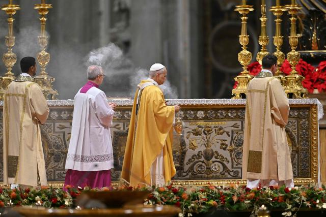 Pope Leo XIV (C) carries an incent burner as he performs the Christmas Eve mass at St Peter's Basilica in the Vatican on December 24, 2025. (Photo by Andreas SOLARO / AFP)