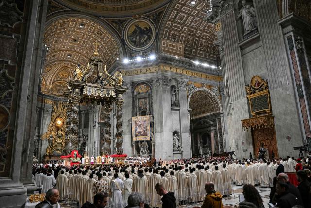 A general view shows a nview of the basilica interior as Pope Leo XIV leads the Christmas Eve mass at St Peter's Basilica in the Vatican on December 24, 2025. (Photo by Andreas SOLARO / AFP)