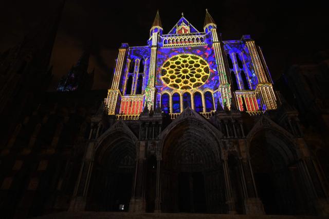 This photograph shows the illuminated East Portal of Notre-Dame Cathedral in Chartres on Christmas Eve prior to the start of the midnight Christmas mass in Chartres, north-central France, southwest of Paris, on December 24, 2025. (Photo by JEAN-FRANCOIS MONIER / AFP)