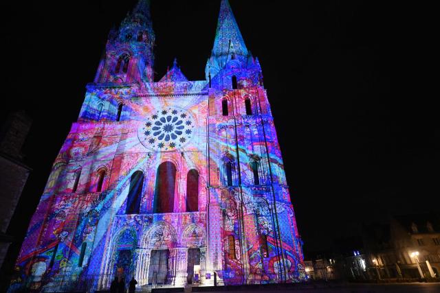 This photograph shows the illuminated South Portal of Notre-Dame Cathedral in Chartres on Christmas Eve prior to the start of the midnight Christmas mass in Chartres, north-central France, southwest of Paris, on December 24, 2025. (Photo by JEAN-FRANCOIS MONIER / AFP)