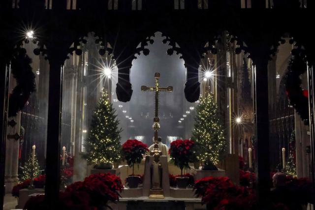 Father Enrique Salvo speaks during a Christmas Mass at St. Patrick’s Cathedral on Christmas Eve on December 24, 2025 in New York. (Photo by ANGELA WEISS / AFP)