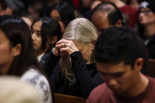 People attend a Christmas Mass at St. Patrick’s Cathedral on Christmas Eve on December 24, 2025 in New York. (Photo by ANGELA WEISS / AFP)