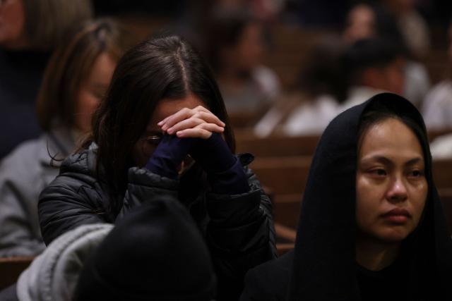 People attend a Christmas Mass at St. Patrick’s Cathedral on Christmas Eve on December 24, 2025 in New York. (Photo by ANGELA WEISS / AFP)