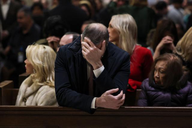 People attend a Christmas Mass at St. Patrick’s Cathedral on Christmas Eve on December 24, 2025 in New York. (Photo by ANGELA WEISS / AFP)