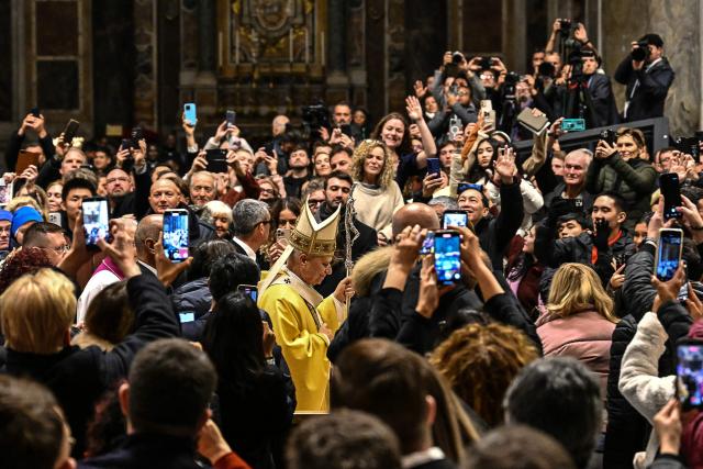 Pope Leo XIV (C) performs the Christmas Eve mass at St Peter's Basilica in the Vatican on December 24, 2025. (Photo by Andreas SOLARO / AFP)
