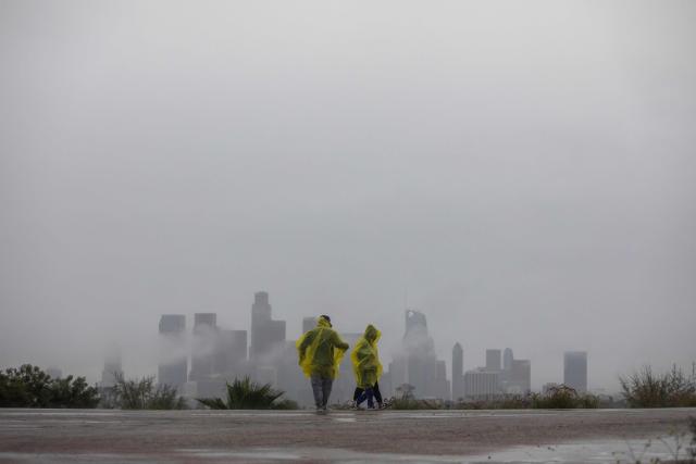 A family walk at Elysian Park in the rain on December 24, 2025 in Los Angeles, California. A major winter storm rolled into California on December 23, forcing hundreds of evacuations in burn areas while threatening flooding and travel delays through Christmas for much of the state, officials said.
A "strong atmospheric river brings heavy rain, snow, and wind to California through Friday," the National Weather Service said in a statement on December 23, warning anyone in northern, central and southern parts of the state to "exercise extreme caution." (Photo by Apu GOMES / AFP)