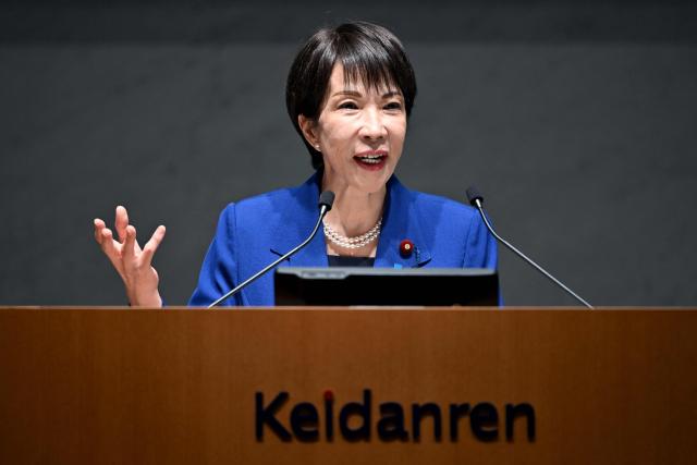 Japan's Prime Minister Sanae Takaichi delivers a speech at the 14th Council Meeting of the Japan Business Federation, or Keidanren, in Tokyo on December 25, 2025. (Photo by Kazuhiro NOGI / AFP)