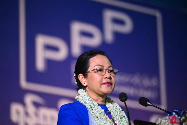 Thet Thet Khine, chairperson of the People's Pioneer Party (PPP), speaks during an election campaign event in Yangon on December 25, 2025. (Photo by Sai Aung MAIN / AFP)