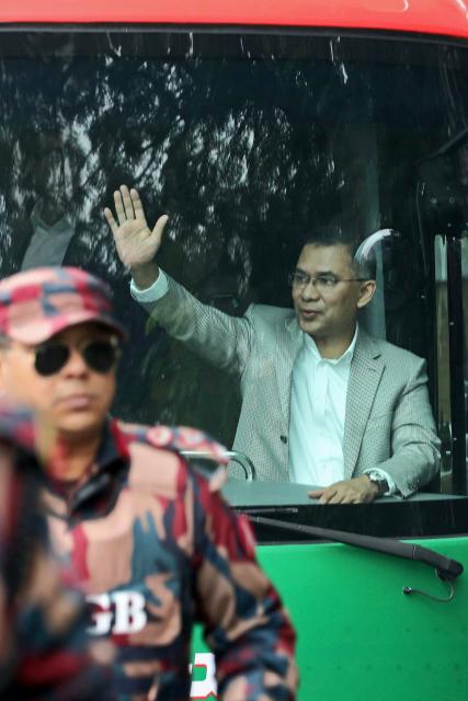 Acting chairman of the Bangladesh Nationalist Party (BNP), Tarique Rahman waves to supporters upon his arrival in Dhaka on December 25, 2025. Aspiring prime minister and political heavyweight Rahman was welcomed back to Bangladesh on December 25 by huge crowds of joyous supporters after 17 years in self-imposed exile. (Photo by Kamrul Islam RATAN / AFP)