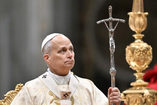 Pope Leo XIV performs the Christmas mass at St Peter's Basilica in the Vatican on December 25, 2025. (Photo by Tiziana FABI / AFP)