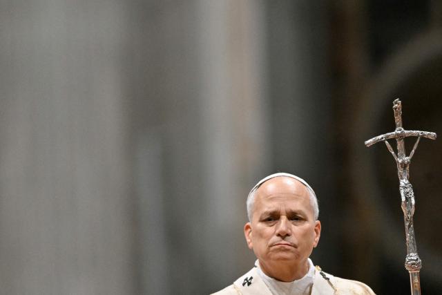 Pope Leo XIV looks on as he performs the Christmas mass at St Peter's Basilica in the Vatican on December 25, 2025. (Photo by Tiziana FABI / AFP)