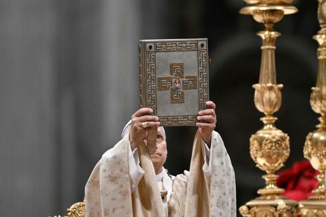 Pope Leo XIV performs the Christmas mass at St Peter's Basilica in the Vatican on December 25, 2025. (Photo by Tiziana FABI / AFP)