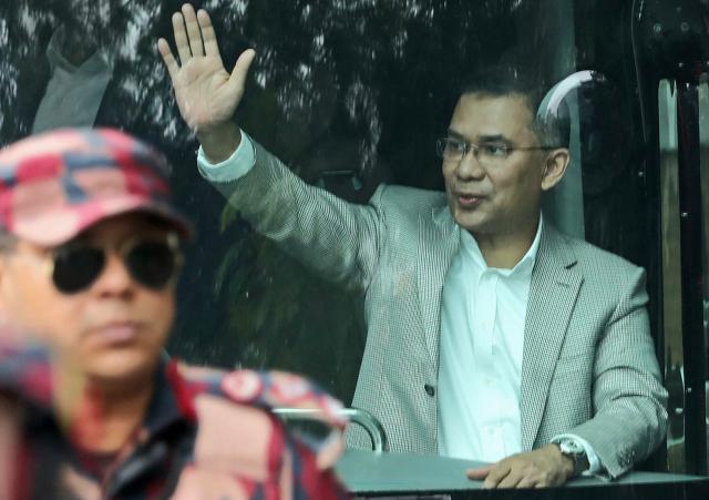 Acting chairman of the Bangladesh Nationalist Party (BNP) Tarique Rahman waves to supporters from a bus upon his arrival in Dhaka on December 25, 2025. Aspiring prime minister and political heavyweight Rahman was welcomed back to Bangladesh on December 25 by huge crowds of joyous supporters after 17 years in self-imposed exile. (Photo by Kamrul Islam RATAN / AFP)