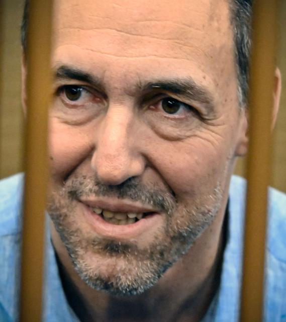 (FILES) French Laurent Vinatier, 47, an employee of Swiss NGO Centre for Humanitarian Dialogue, who was arrested in Russia in early June 2024 and accused of allegedly gathering military information, attends a court session in Moscow on July 31, 2024. Moscow has made an offer to France regarding jailed researcher Laurent Vinatier, facing espionage charges that could see him sentenced to 20 years in a Russian prison, the Kremlin said on December 25, 2025. (Photo by Alexander NEMENOV / AFP)