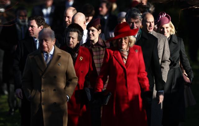 Britain's King Charles III (2L) and Britain's Queen Camilla (4R) lead Jack Brooksbank (L), Britain's Prince William, Prince of Wales (3L), Britain's Princess Anne, Princess Royal (4L), Britain's Princess Eugenie of York (C), Vice Admiral Timothy Laurence (3R), Britain's Prince Edward, Duke of Edinburgh (2R) and Zara Tindall (R) and others as they arrive for the Royal Family's traditional Christmas Day service at St Mary Magdalene Church on the Sandringham Estate in eastern England, on December 25, 2025. (Photo by HENRY NICHOLLS / AFP)