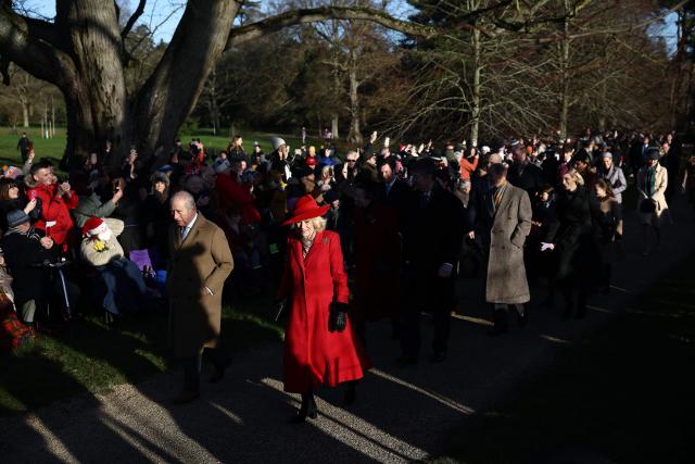 Britain's King Charles III and Britain's Queen Camilla lead members of the Royal Family as they arrive for their traditional Christmas Day service at St Mary Magdalene Church on the Sandringham Estate in eastern England, on December 25, 2025. (Photo by Henry NICHOLLS / AFP)