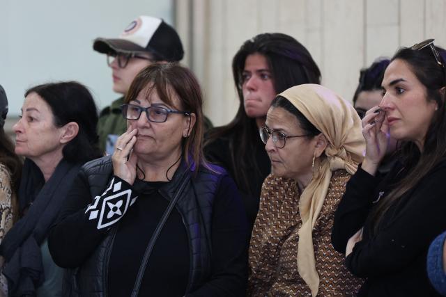 Relatives and friends of Dan Elkayam, 27, a French Jewish engineer from Le Bourget, who was killed in the terrorist attack that struck Bondi Beach in Australia on December 14, during the Jewish holiday of Hanukkah, mourn during his funeral at the Ashdod cemetery in southern Israel on December 25, 2025. Fresh details about the run-up to the Bondi killings have emerged in recent days. Police documents released December 22, said the two alleged gunmen had carried out "firearms training" in what was believed to be the New South Wales countryside. Authorities alleged the pair "meticulously planned" the attack "for many months". (Photo by Jack GUEZ / AFP)