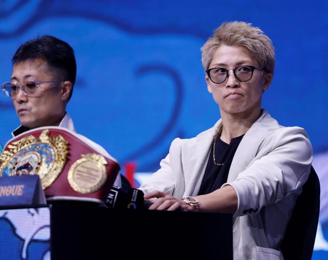 Japan's boxer Naoya Inoue (R) and his father Shingo Inoue attend the final press conference   at the Boulevard Entertainment City, In Riyadh on December 25, 2025, ahead of the final major fight card of the year against Mexico's David Picasso presented by the Riyadh season entitled "The Ring V night of Samurai". The fight will take place at the Mohammed Abdo Arena, in Riyadh on December 27, 2025. (Photo by Fayez Nureldine / AFP)